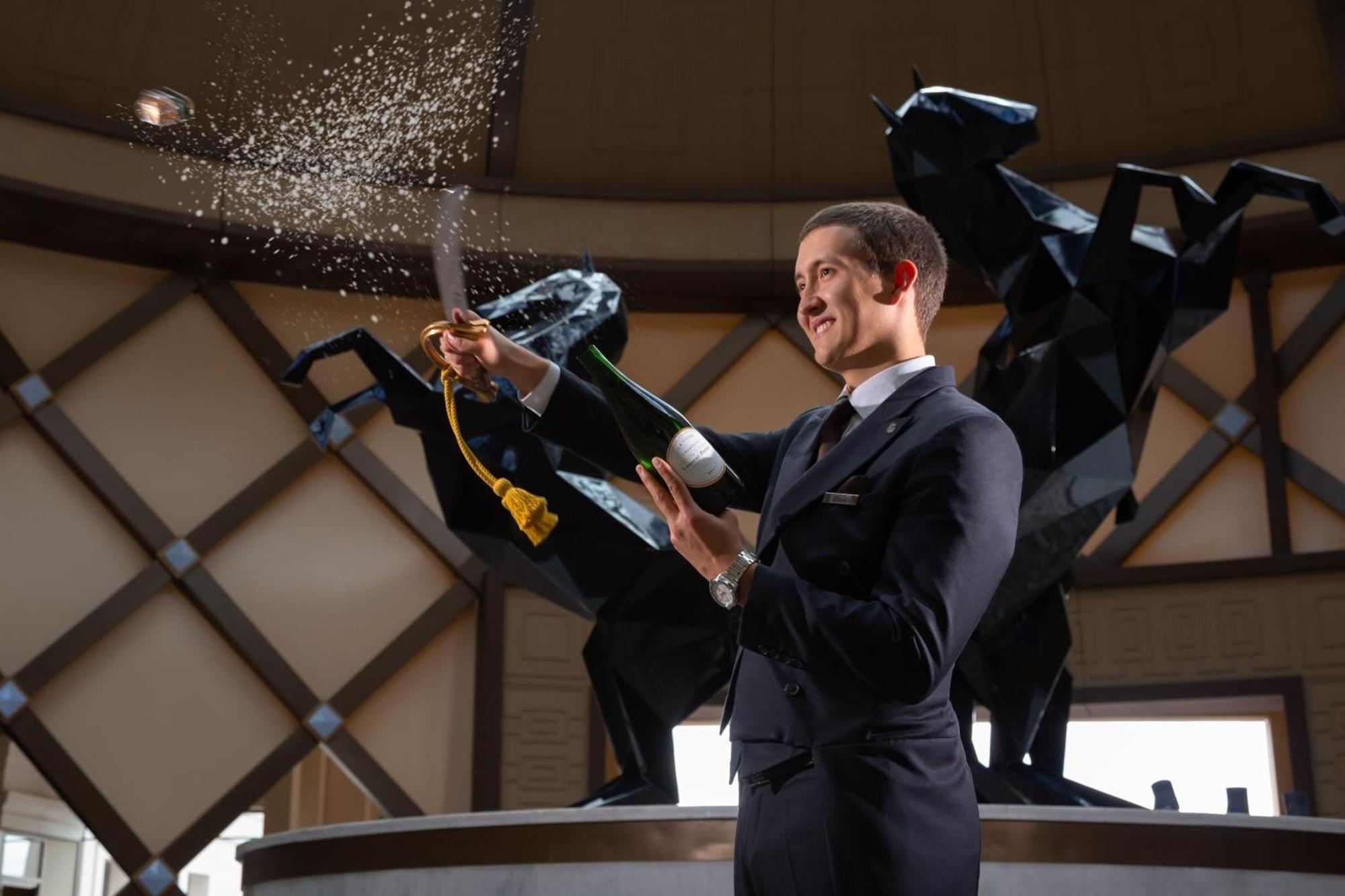 The St. Regis Astana Hotel Bagian luar foto A butler at the Atlantis Resort, Bahamas