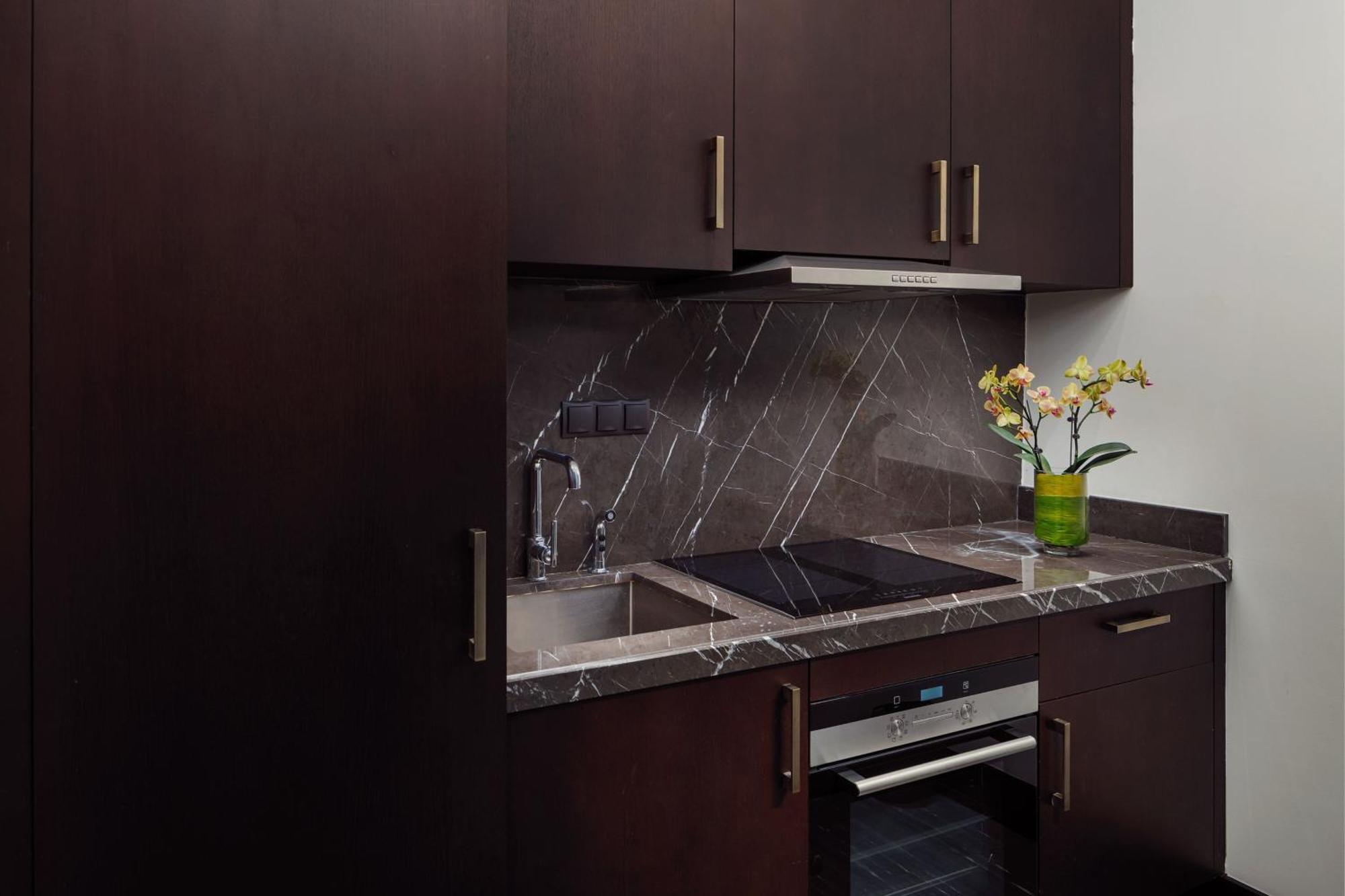 The St. Regis Astana Hotel Bagian luar foto A kitchen in a typical apartment